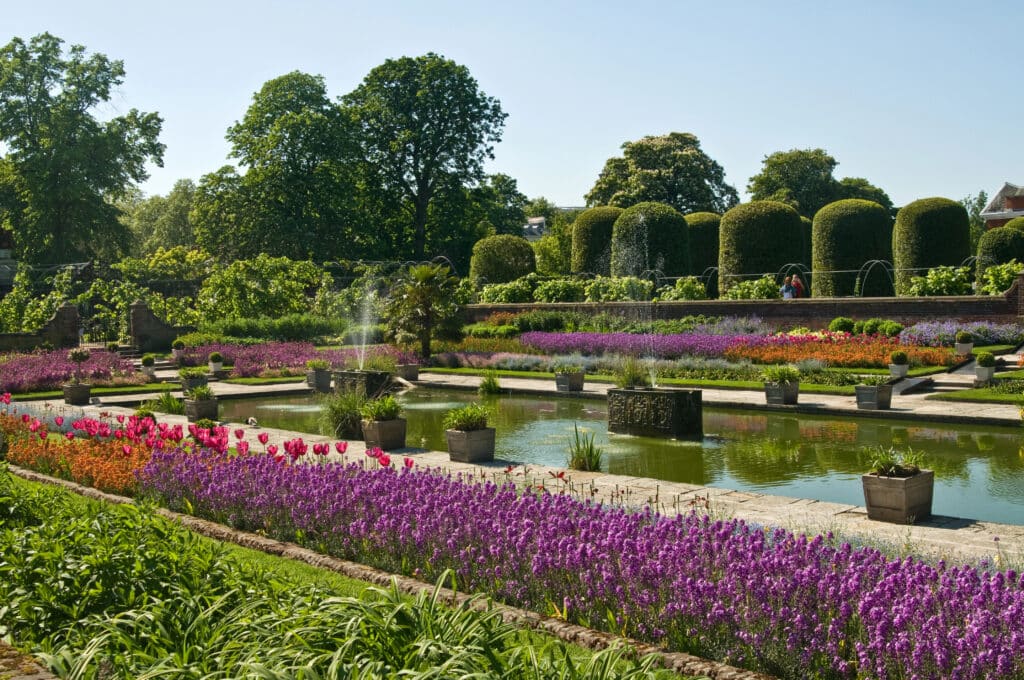 Kensington Gardens featuring beautifully landscaped trees and flowerbeds.