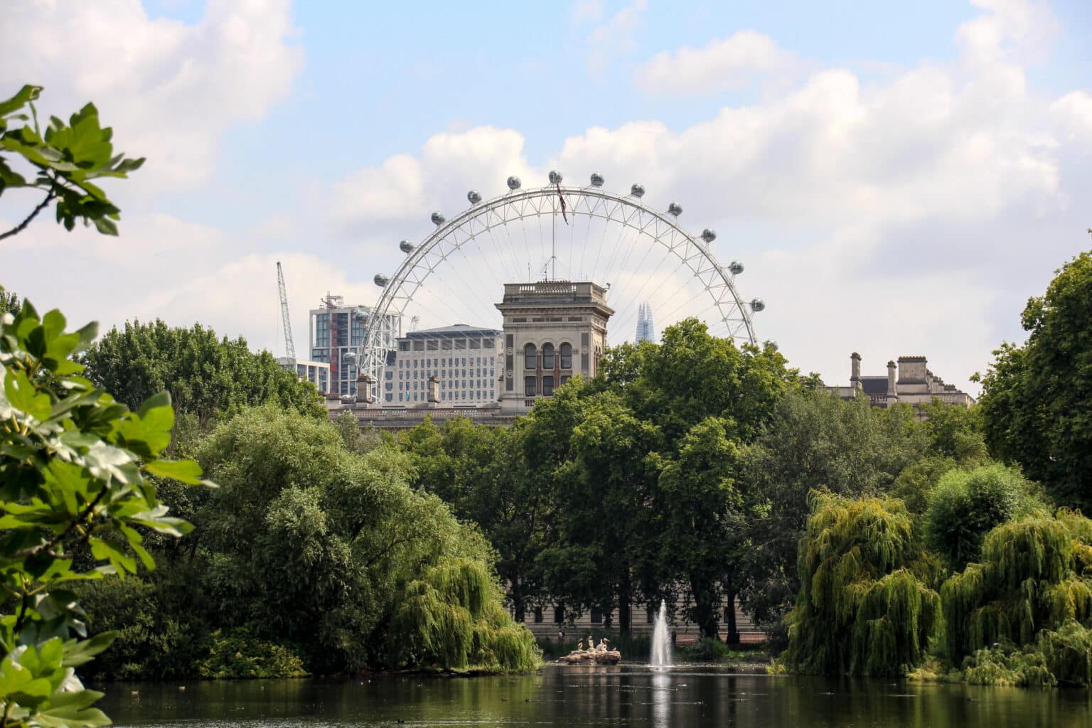 Park in London with London Eye in the background.