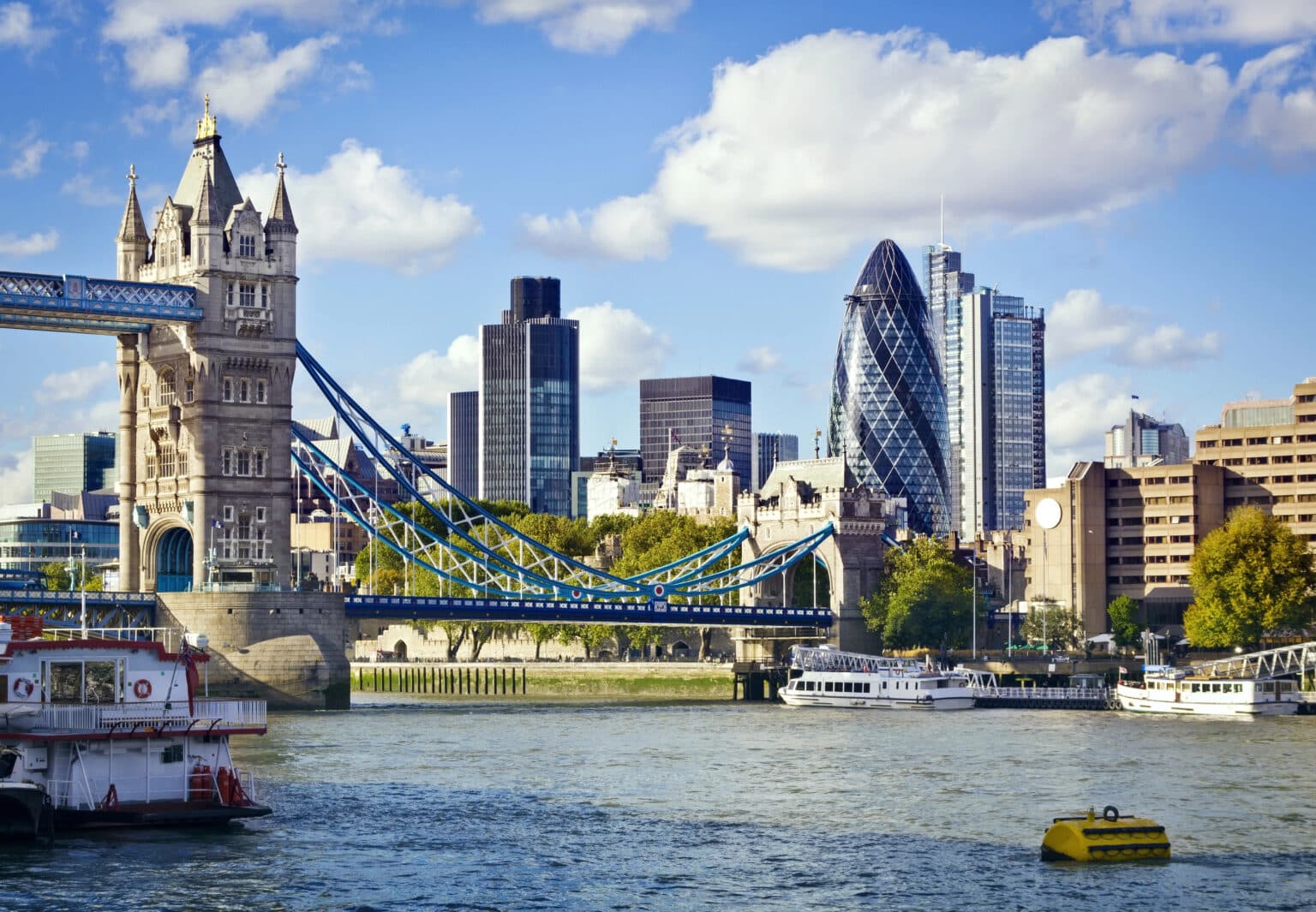 London skyline featuring Tower Bridge, Tower of London, and The Gherkin.