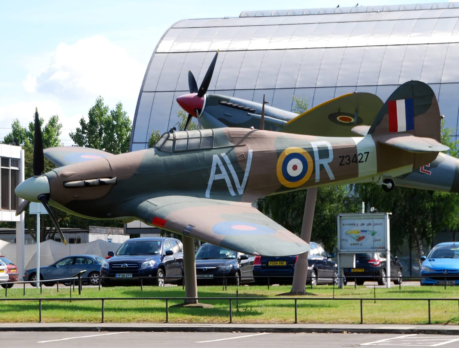 A Spitfire and a Hurricane on display at the main entrance of the RAF Museum in Hendon, London.